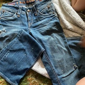 Rock revival jeans with unique pattern wash